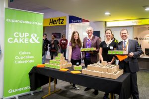 Grant Kerr and Colin Keel welcoming passengers with treats_med